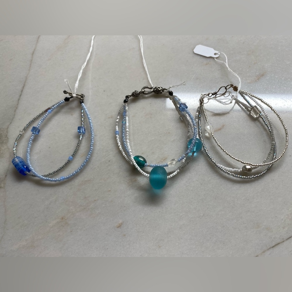 3 double/triple stranded beaded bracelets in silvers and blues, with clasps